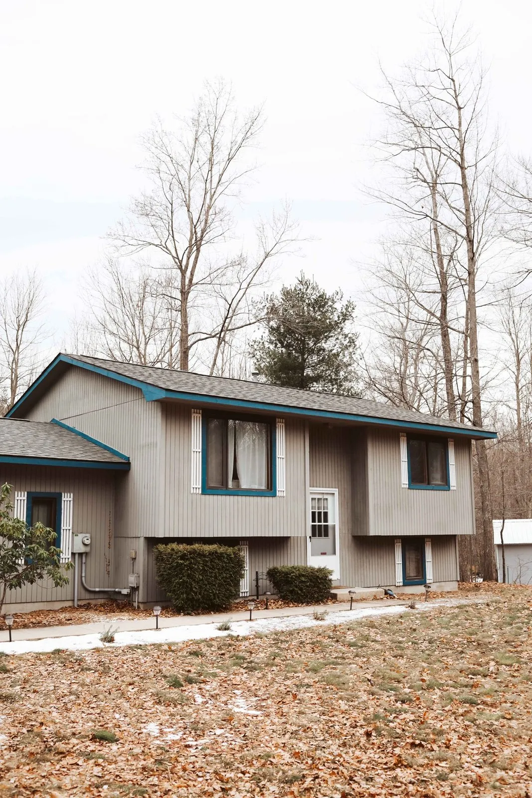 Split-level re-side with teal fascia