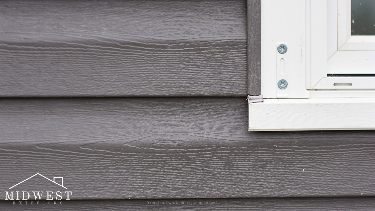 Close-up of vinyl siding panel profile and trim details